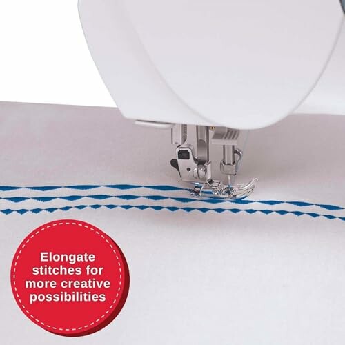 Sewing machine creating blue zigzag stitches on fabric.