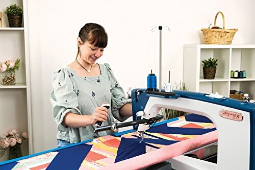 Woman using a quilting machine in a craft room.